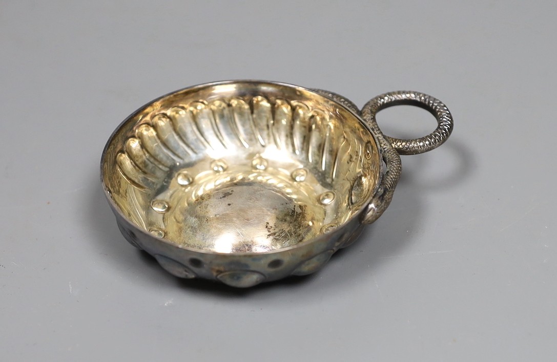 An early 20th century French white metal taste vin, 10cm over handle.